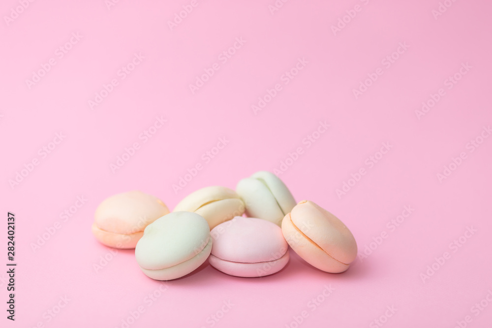 Delicate colored marshmallows on a pink background minimal style. Copy space Delicate colored marshmallows on a pink background minimal style. Copy space