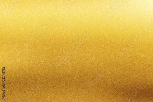 Gold texture background. Retro golden shiny wall surface. photo