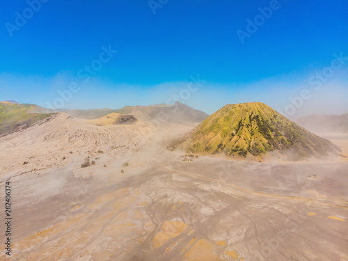 Aerial shot of the Bromo volcano and Batok volcano at the Bromo Tengger Semeru National Park on Java Island  Indonesia. One of the most famous volcanic objects in the world. Travel to Indonesia