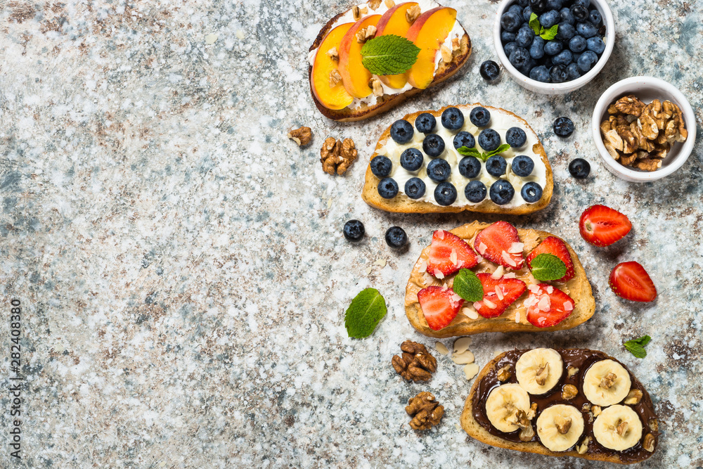 Sweet toast assortment with fresh fruit and berries.