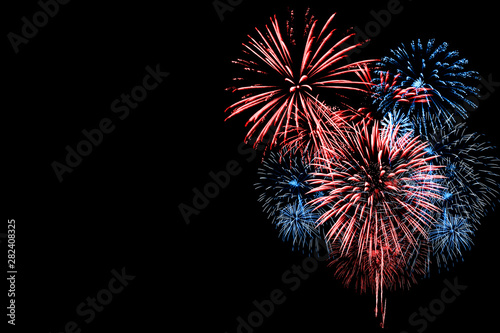 Red and Blue Fireworks on Black background photo