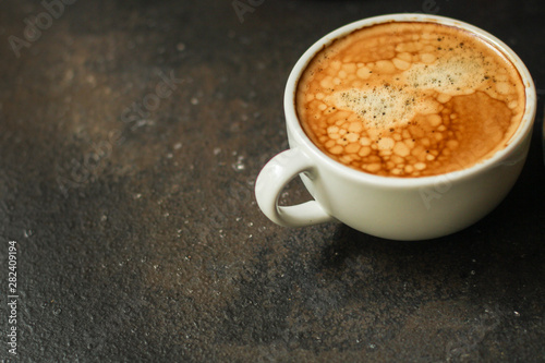coffee freshly brewed in a white cup serving of beverage  coffee grain . food. top. copy space