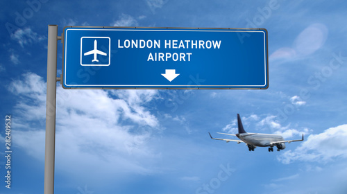 Plane landing in London Heathrow with signboard