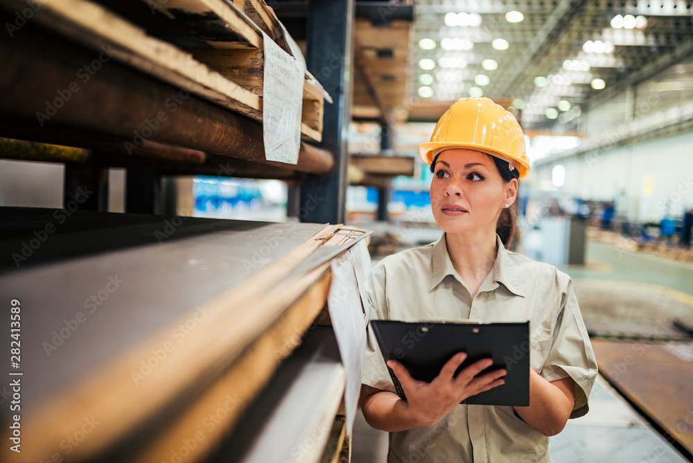 Portrait of a female supervisor working at factory warehouse. Portrait of a female supervisor working at factory warehouse.