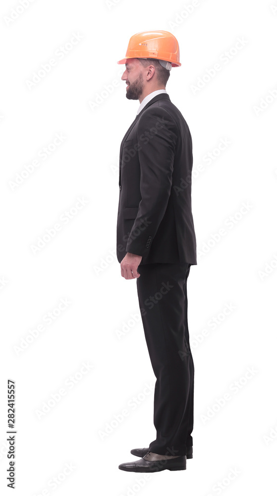 in full growth. successful businessman in a protective helmet in full growth. successful businessman in a protective helmet