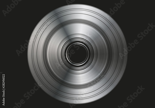 Disco de plata sobre fondo negro.