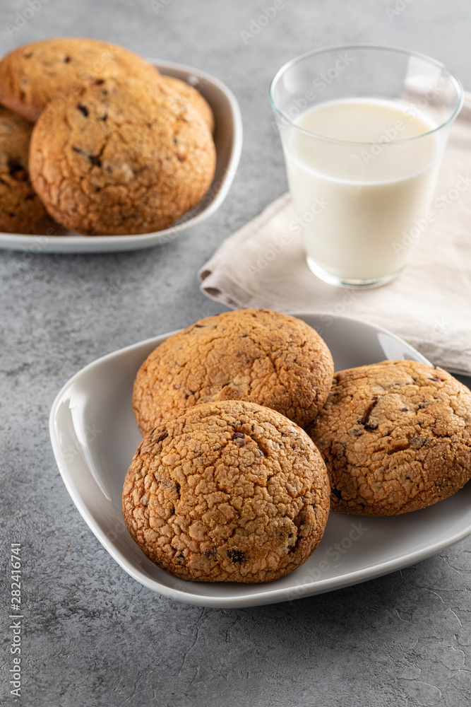 Chocolate chip cookies with milk on grey table. Copy space. Chocolate chip cookies with milk on grey table. Copy space.