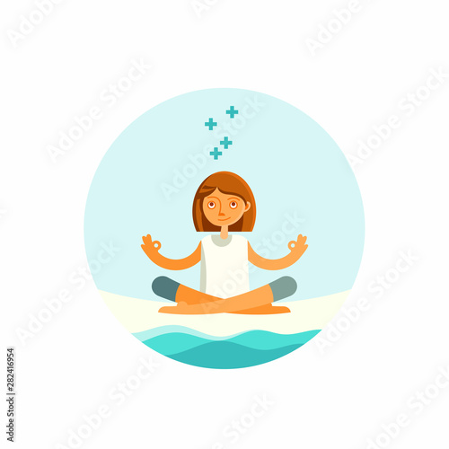 Woman in lotus position by the seaside.