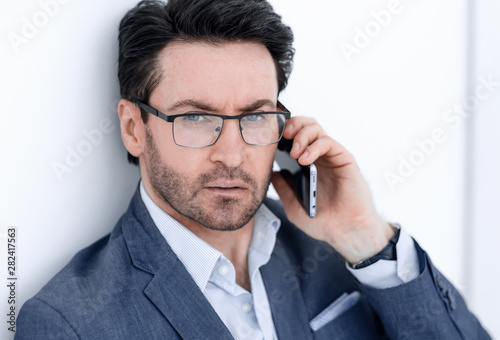 handsome businessman talking on the phone