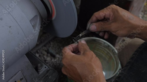 Sharpening Tari Knife - SlowMo 50fps to 25fps photo