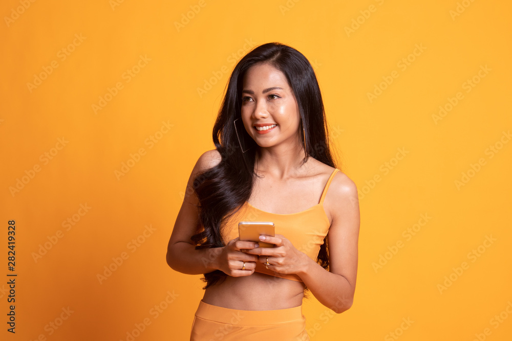 Young Asian woman with mobile phone.