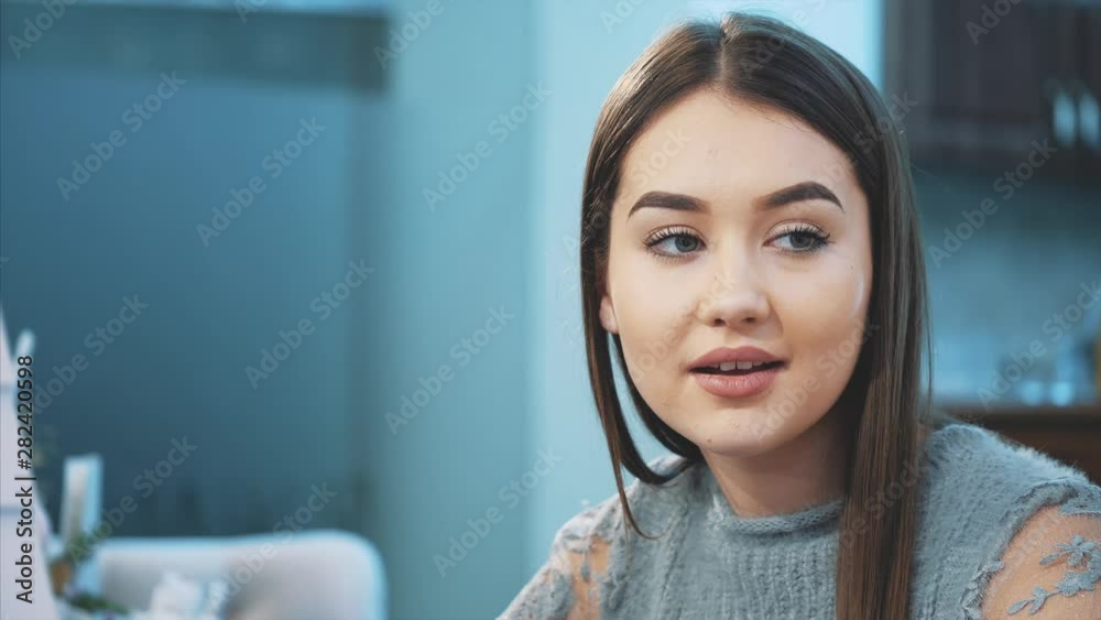 Young cute good girl friends, met in a cafe. Beautiful young girls smiling, enjoying the time spent sitting together at the cafe's table. Young cute good girl friends, met in a cafe. Beautiful young girls smiling, enjoying the time spent sitting together at the cafe's table.