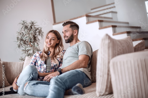 loving couple relaxing on the couch on a free evening