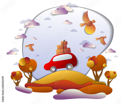 Car travel and tourism in autumn, red minivan with luggage riding off road in orange fall meadows among trees, birds and clouds in the sky, paper cut vector illustration of auto in scenic landscape.