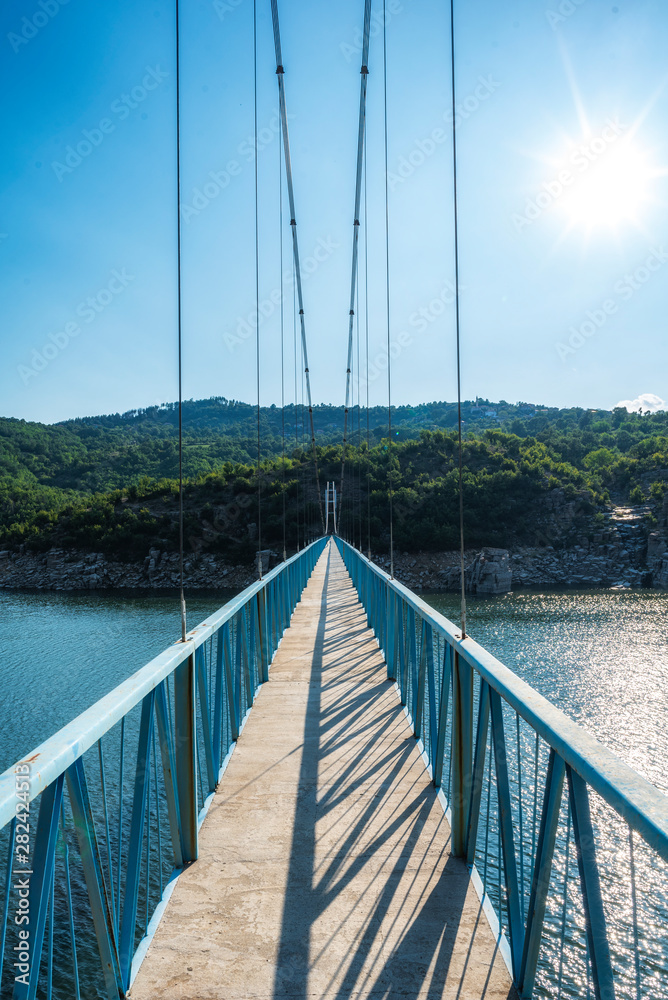 Fototapeta premium Suspension bridge over Kardzhali dam, Bulgaria near Suhovo village