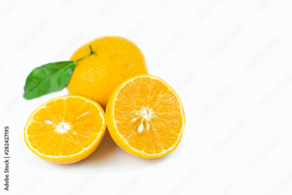 Orange fruits with leaf on isolated white background.