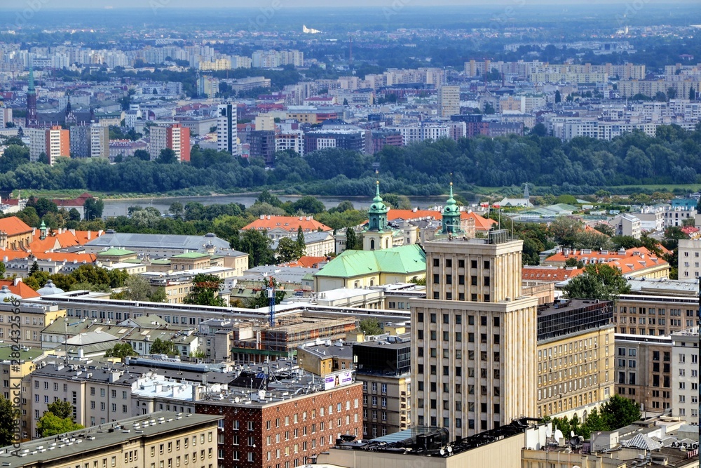 Fototapeta premium Aerial cityscape of Warsaw city from the viewpoint located on the 30th floor of Palace of Culture and Science. Warsaw, Poland