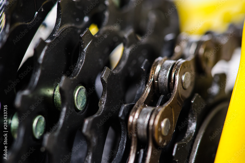 Parts of yellow bicycle on a studio white background. Close up details Parts of yellow bicycle on a studio white background. Close up details