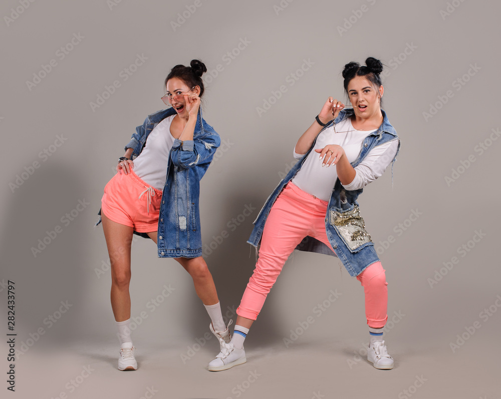 Fototapeta premium Young beautiful dancers posing in studio