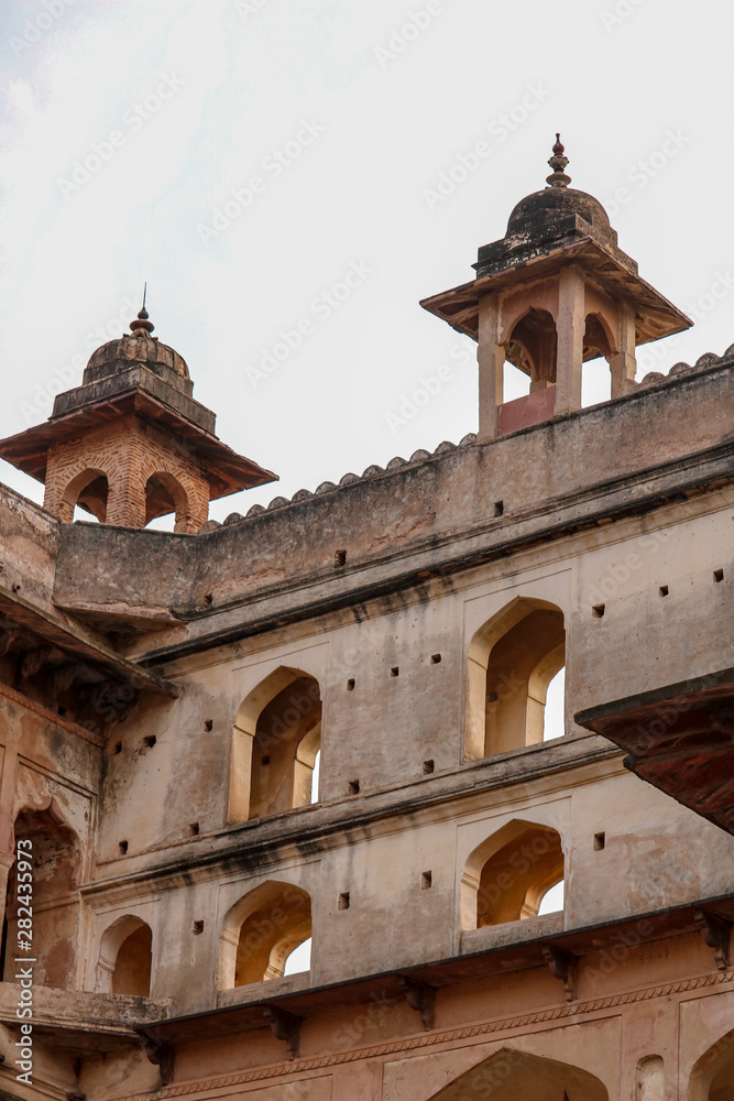 Ornate dome roofs of the Orchha Palace in sunset, Orchha, India