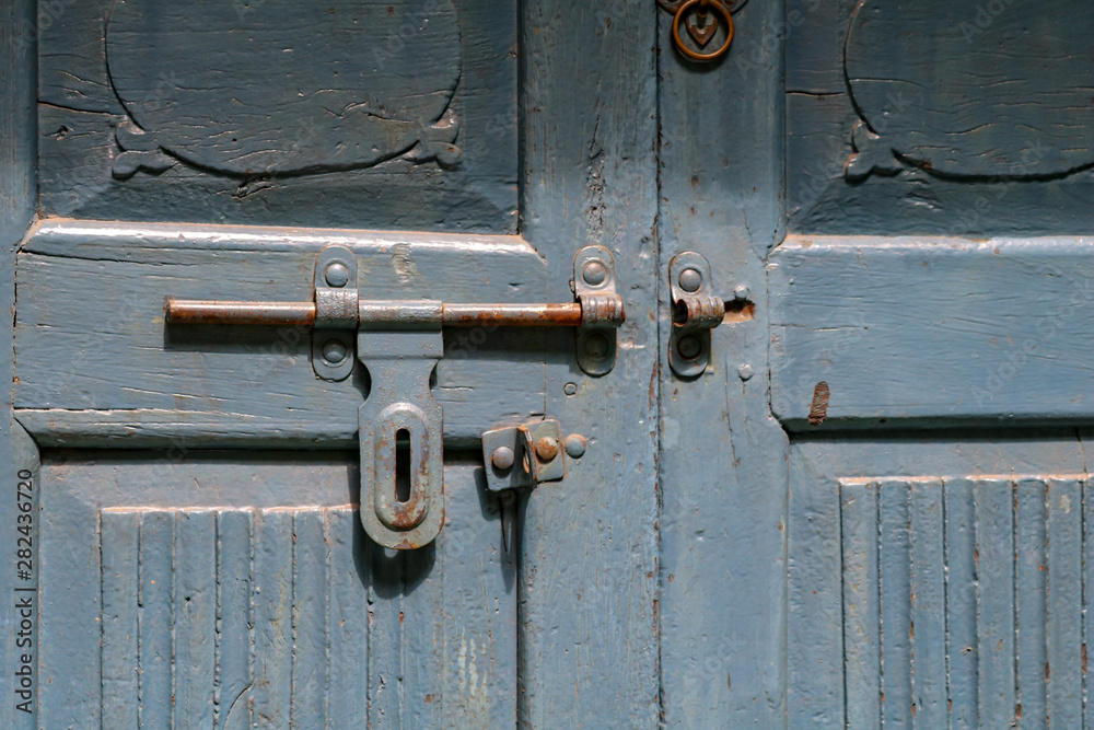 Old wooden blue entrance door with iron fittings on the grounds of Humayun's Tomb, Delhi, India Old wooden blue entrance door with iron fittings on the grounds of Humayun's Tomb, Delhi, India