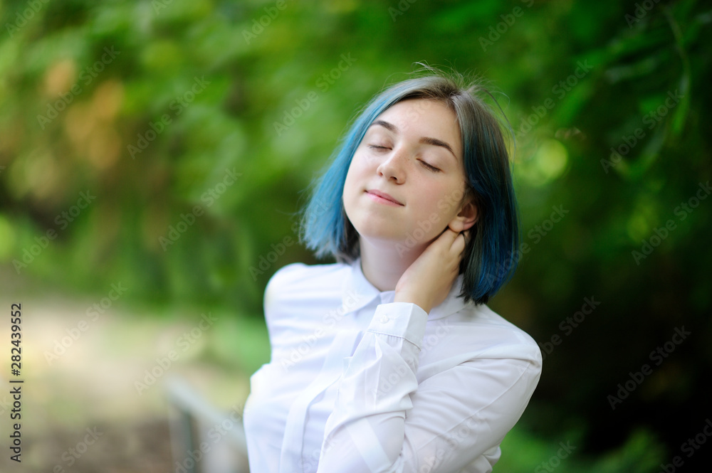 teenage girl in white blouse in green summer park teenage girl in white blouse in green summer park