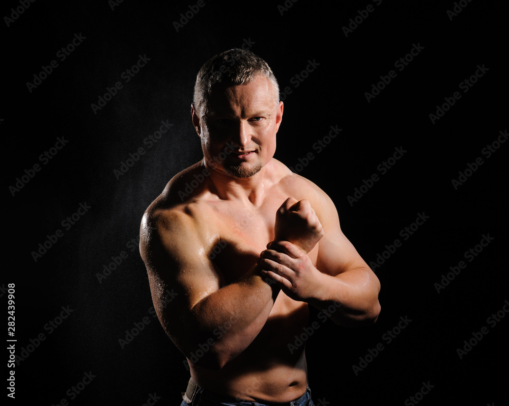 Image of muscle man posing in studio