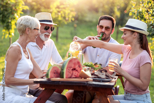 Family having party in garden in summer