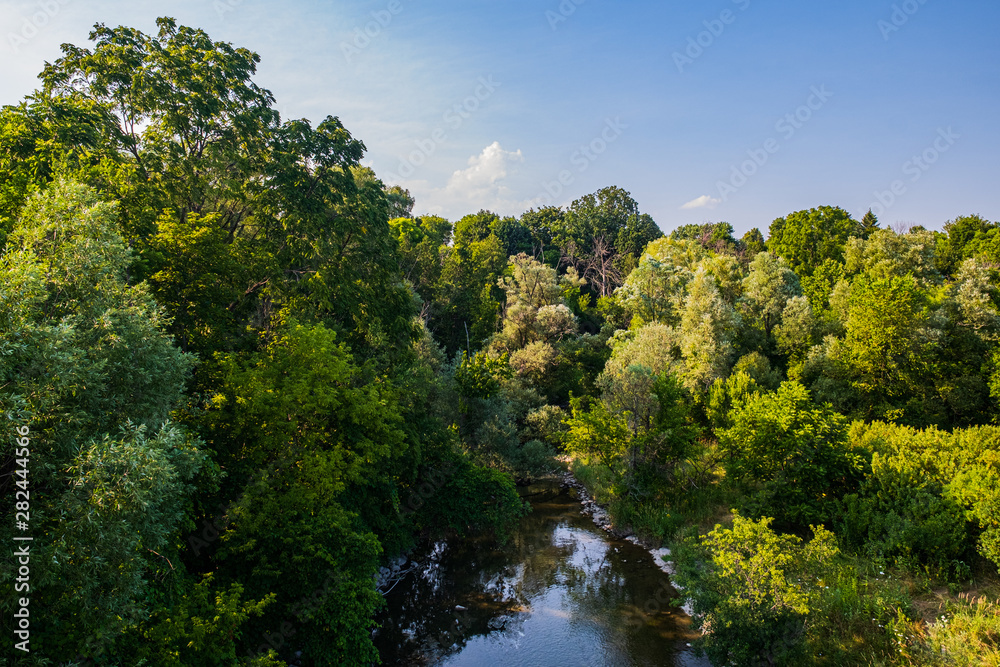 park at Markham Ontario Canada with bridge, river, and trees park at Markham Ontario Canada with bridge, river, and trees