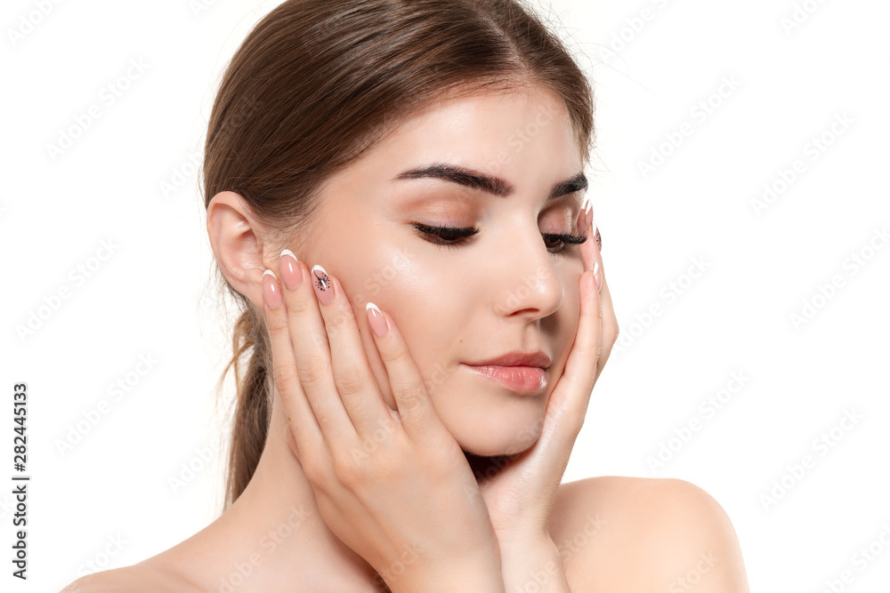 Close-up portrait of a beautiful young girl holding hands near face isolated over white background. Close-up portrait of a beautiful young girl holding hands near face isolated over white background.