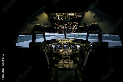 Fototapeta Naklejka Na Ścianę i Meble -  Aircraft interior, cockpit view inside the airliner. Point of view from a pilot place in a plane.