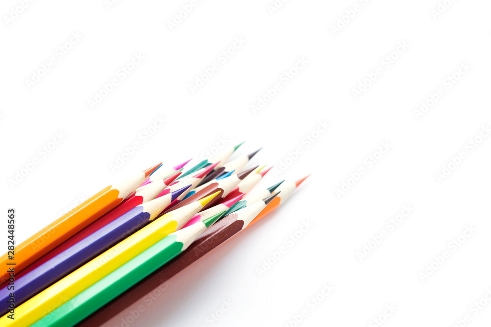 Set of school color pencils isolated on white background. Top view, flat lay composition, frame, layout. Copy space for text or design.