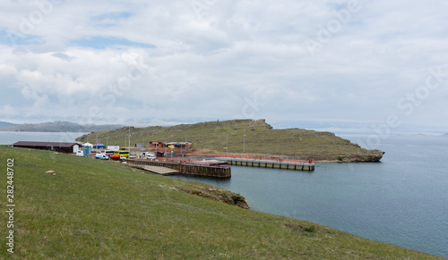 View of the ferry pier on Lake Baikal on a cloudy summer day