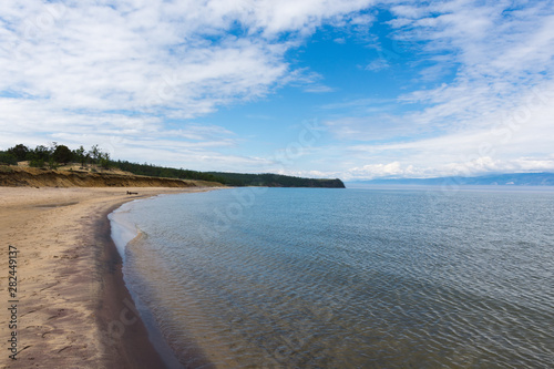 Fototapeta Naklejka Na Ścianę i Meble -  Beautiful view of Lake Baikal on a clear summer day from the shore of Olkhon Island