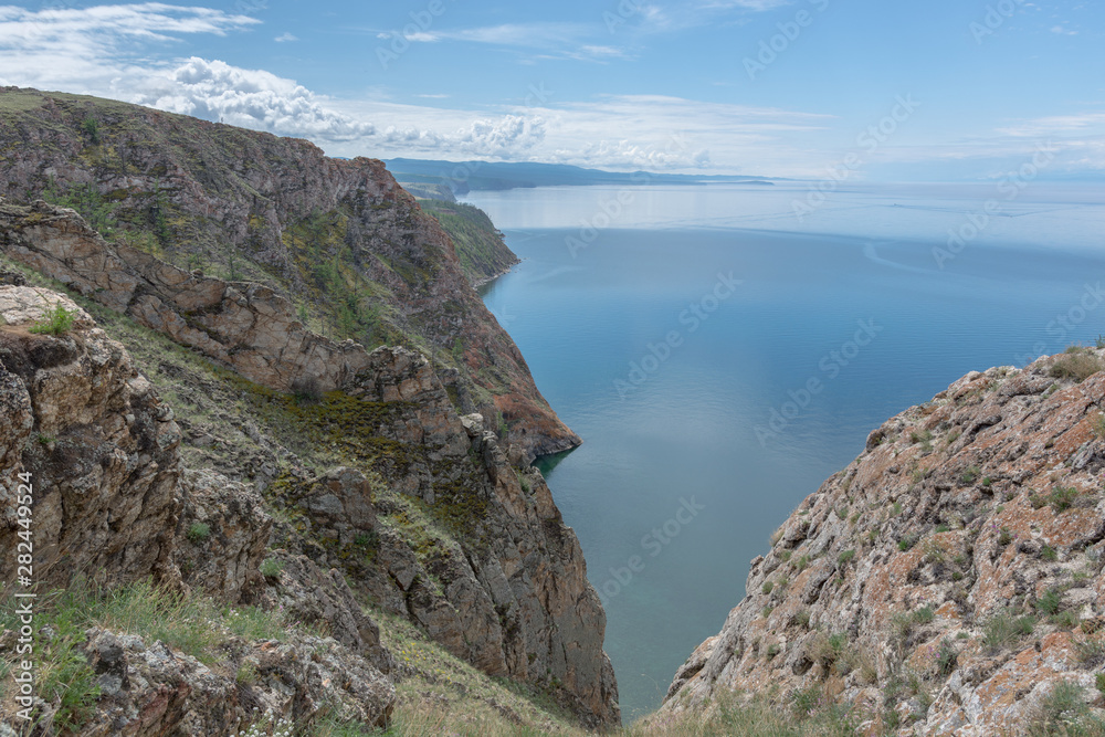 Beautiful view of Lake Baikal on a clear summer day from the shore of Olkhon Island