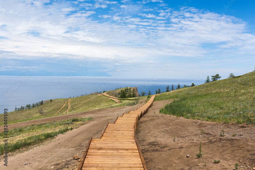 Beautiful view of Lake Baikal on a clear summer day from the shore of Olkhon Island Beautiful view of Lake Baikal on a clear summer day from the shore of Olkhon Island