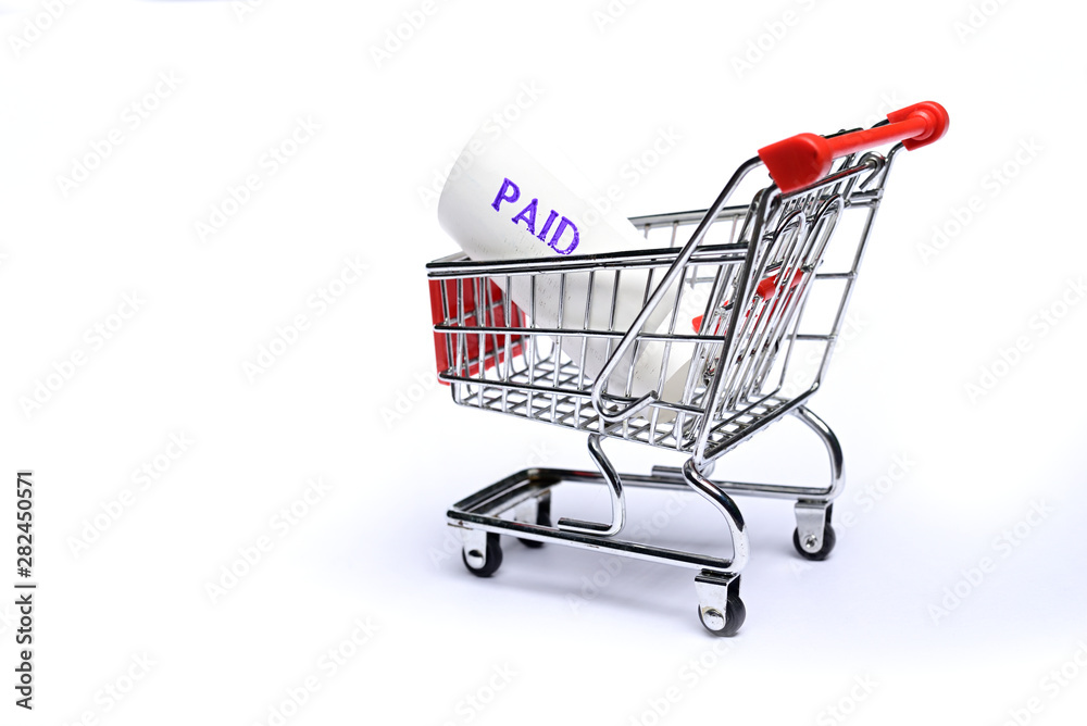 Paid Shopping Receipts in shopping trolley isolated on white background. Paid Shopping Receipts in shopping trolley isolated on white background.