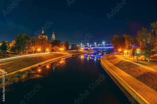 Oryol or Orel city embankment in night, Russia. Oka river with reflected of illuminated historic and religious buildings