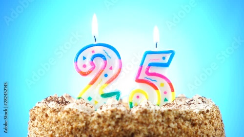 Birthday cake with a burning birthday candle. Number 25. Background changes color