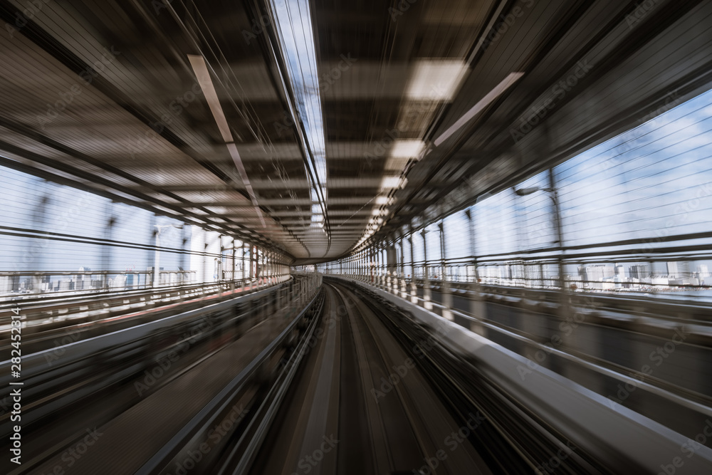 motion-blurred view from a moving train running in tunnel