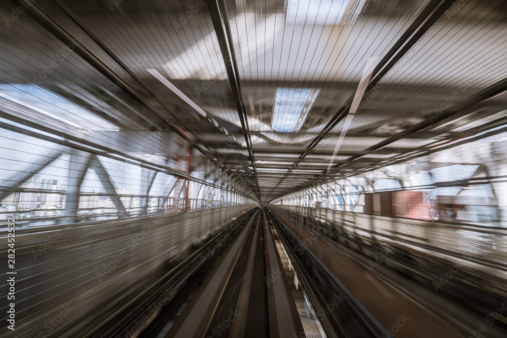 motion-blurred view from a moving train running in tunnel motion-blurred view from a moving train running in tunnel
