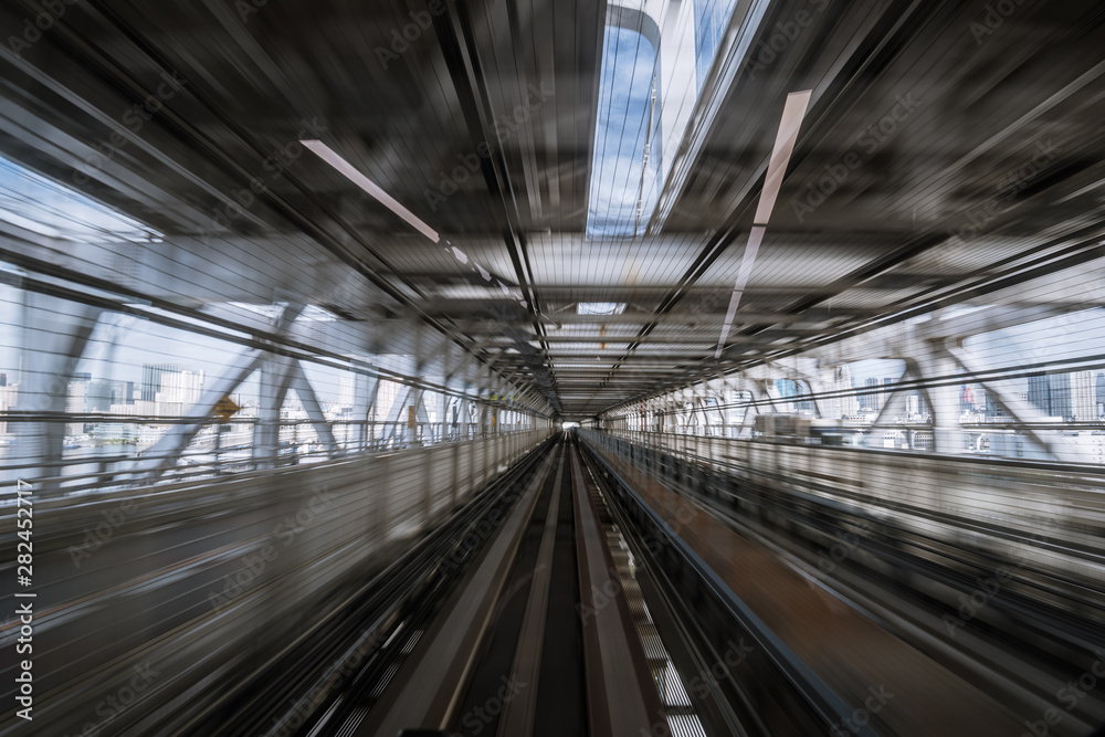 motion-blurred view from a moving train running in tunnel motion-blurred view from a moving train running in tunnel