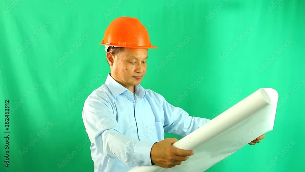 Engineer man with green background, in studio Chiangmai Thailand Engineer man with green background, in studio Chiangmai Thailand