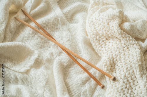Thread for knitting in a basket closeup. Knitting as a hobby. Accessories for knitting.