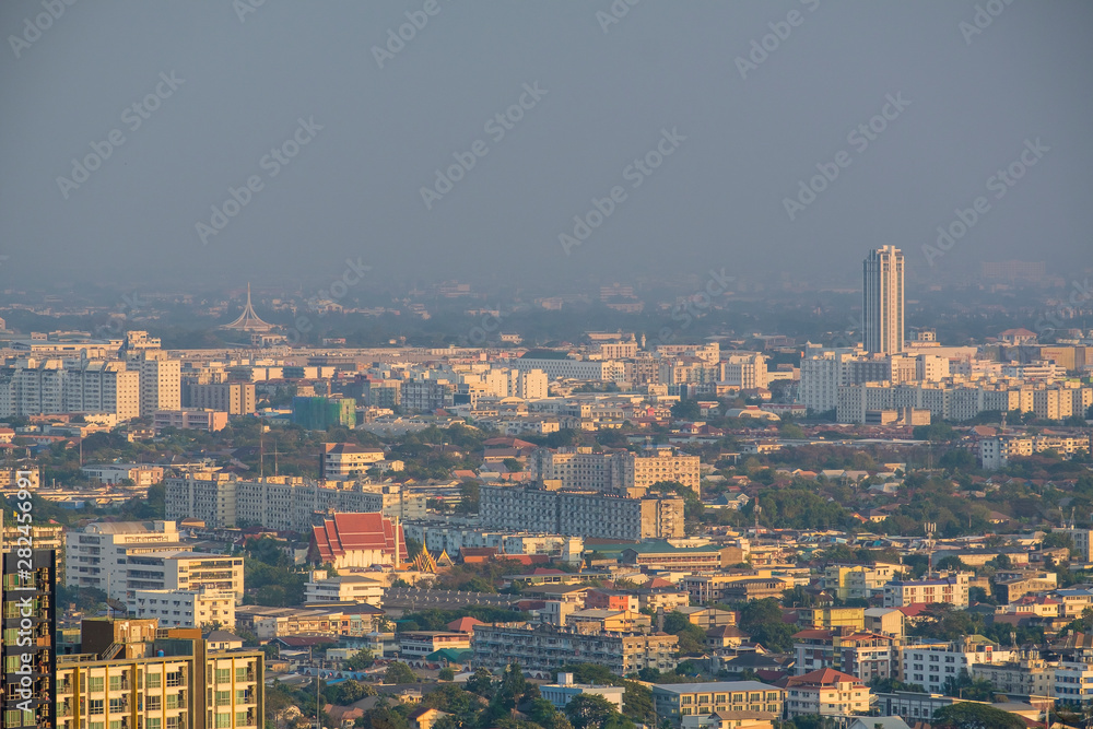 a landscape of residential and commercial buildings at high angle veiw in Bangkok city during smoke pollution 