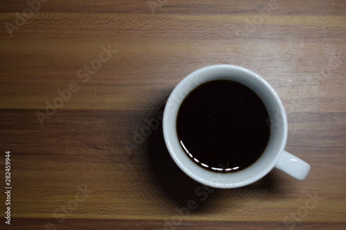 A Cup Of Coffee at Wooden Table Texture