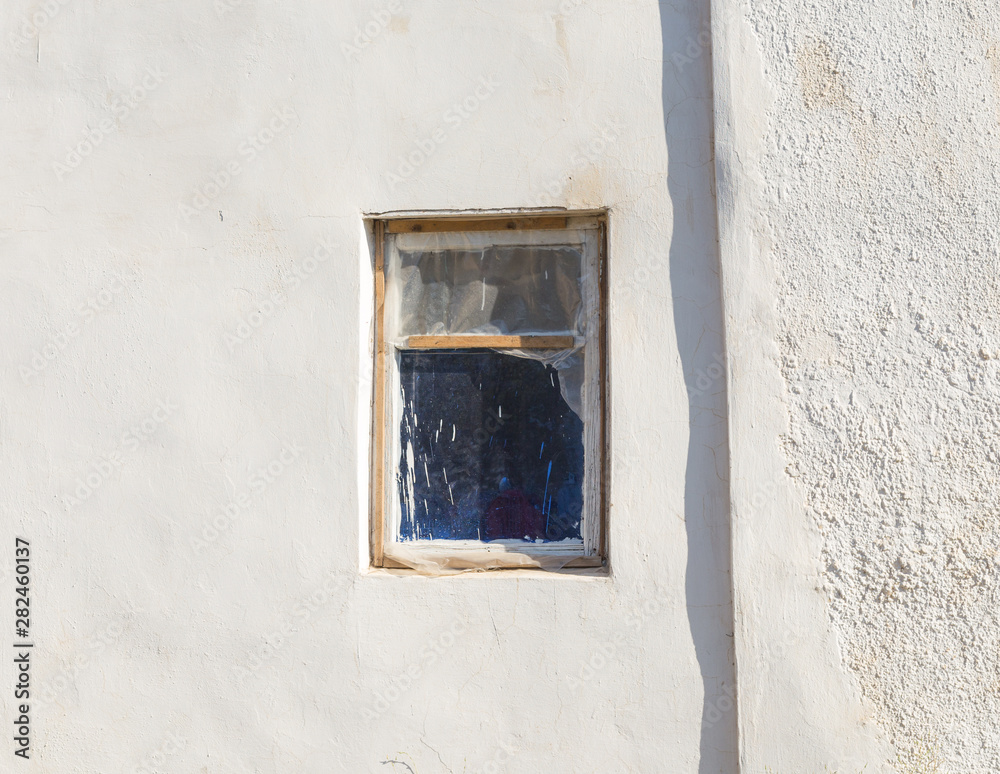 windows on an old abandoned house windows on an old abandoned house