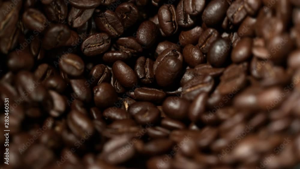 Super Slow Motion Shot of Rotating Coffee Beans in the Grinder at 1000fps. Super Slow Motion Shot of Rotating Coffee Beans in the Grinder at 1000fps.