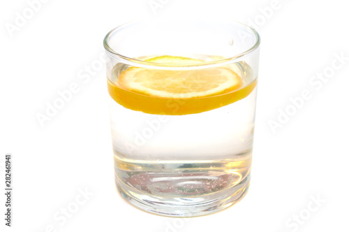Glass of pure water with lemon isolated on a white background