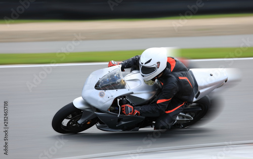 Racing bike rider on the race track